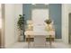 Stylish home office with a modern desk, comfortable chair, and a large painting at 25162 N 177Th Dr, Surprise, AZ 85387