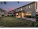 Exterior view featuring the backyard, patio, and the rear elevation of the home at 2557 N Springfield St, Buckeye, AZ 85396