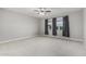 Spacious bedroom features neutral carpet, modern ceiling fan, and large windows at 2557 N Springfield St, Buckeye, AZ 85396