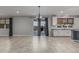 Open concept dining room with sliding glass doors and stylish window coverings at 2557 N Springfield St, Buckeye, AZ 85396