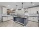 Open kitchen with a large island, stainless steel appliances, and plenty of counter space at 2557 N Springfield St, Buckeye, AZ 85396