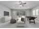 Comfortable living room is furnished with a cozy sectional and a foosball table for entertainment at 2557 N Springfield St, Buckeye, AZ 85396