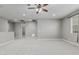 Large loft area with plush carpeting, recessed lighting, and a ceiling fan for added comfort at 2557 N Springfield St, Buckeye, AZ 85396