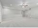 Expansive loft area featuring neutral carpet, recessed lighting, and plenty of open space at 2557 N Springfield St, Buckeye, AZ 85396