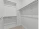 Spacious walk-in closet with built-in shelving and racks providing ample storage at 2557 N Springfield St, Buckeye, AZ 85396