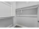 Bright walk-in closet featuring shelving for optimal storage solutions at 2557 N Springfield St, Buckeye, AZ 85396
