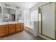 Bathroom featuring double sinks with wooden cabinets, a shower, and a tub at 285 W Goldfinch Way, Chandler, AZ 85286