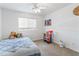Charming bedroom with fun decor, a plush bedspread, and bright natural light at 285 W Goldfinch Way, Chandler, AZ 85286