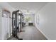 Bonus room is set up as home gym, with fitness equipment and a view of the landscaped yard at 285 W Goldfinch Way, Chandler, AZ 85286