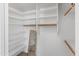 Bright white walk-in closet with shelving and wooden rods at 285 W Goldfinch Way, Chandler, AZ 85286
