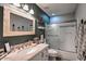 Well-lit bathroom with a vanity, shower, and contemporary design elements at 29023 N 46Th Way, Cave Creek, AZ 85331