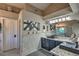 Elegant bathroom with double sinks, granite countertops, modern light fixtures, and decorative mirrors at 29023 N 46Th Way, Cave Creek, AZ 85331