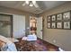 Comfortable bedroom with a ceiling fan, closet, and unique decor at 29023 N 46Th Way, Cave Creek, AZ 85331