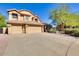 Inviting home featuring a three-car garage, desert landscaping, and a tile roof at 29023 N 46Th Way, Cave Creek, AZ 85331