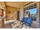 Inviting front porch area with comfortable seating and ample natural light at 29023 N 46Th Way, Cave Creek, AZ 85331