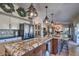 Open kitchen featuring an island with granite countertops, stainless steel appliances, and pendant lights at 29023 N 46Th Way, Cave Creek, AZ 85331