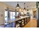 Modern kitchen featuring a large island with granite countertop, pendant lighting, and stainless steel appliances at 29023 N 46Th Way, Cave Creek, AZ 85331