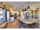 Elegant kitchen with a granite island, modern appliances, pendant lighting, and a breakfast bar at 29023 N 46Th Way, Cave Creek, AZ 85331