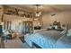 Comfortable main bedroom boasts neutral colors, patterned rug, and eclectic decor accents at 29023 N 46Th Way, Cave Creek, AZ 85331
