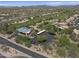 This overhead view highlights the community building and the adjacent parking lot and landscaped grounds at 29606 N Tatum Blvd # 174, Cave Creek, AZ 85331