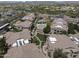 An overhead view of an apartment complex with a pool, green spaces, and walking paths throughout at 29606 N Tatum Blvd # 174, Cave Creek, AZ 85331