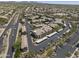 The aerial view showcases many apartment buildings with a variety of parking options and landscaping at 29606 N Tatum Blvd # 174, Cave Creek, AZ 85331