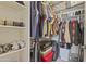 Walk-in closet with shelving, hanging rods, and storage for clothes and luggage at 29606 N Tatum Blvd # 174, Cave Creek, AZ 85331