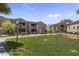 Well-maintained apartment buildings in a community offering green spaces, BBQ areas, and sidewalks for residents at 29606 N Tatum Blvd # 174, Cave Creek, AZ 85331