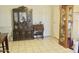 Open dining area featuring a tile floor, ornate display cabinets and natural light at 3001 W Shaw Butte Dr, Phoenix, AZ 85029