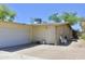 A single-story home featuring a two-car garage and desert landscaping around the side of the home at 3001 W Shaw Butte Dr, Phoenix, AZ 85029