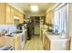 Functional kitchen featuring ample cabinet space, modern appliances, and tile flooring at 3001 W Shaw Butte Dr, Phoenix, AZ 85029