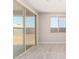 A back patio features sliding glass doors and a large window with a view of the backyard at 31619 N Shady Pasture Ln, San Tan Valley, AZ 85143