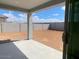Spacious backyard with a concrete patio and block wall, perfect for outdoor living and entertaining at 31619 N Shady Pasture Ln, San Tan Valley, AZ 85143