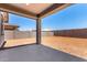 Covered patio that overlooks a spacious backyard, perfect for outdoor entertaining and relaxation at 31619 N Shady Pasture Ln, San Tan Valley, AZ 85143