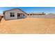 Back of the home with a covered patio and ready to be landscaped backyard with a fence for privacy at 31619 N Shady Pasture Ln, San Tan Valley, AZ 85143