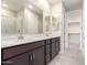 Modern bathroom with double sinks, white countertops, and a glass-enclosed shower at 31619 N Shady Pasture Ln, San Tan Valley, AZ 85143