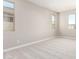 Bedroom with large windows, plush carpet, and neutral color scheme at 31619 N Shady Pasture Ln, San Tan Valley, AZ 85143