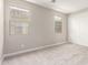 Bedroom with a closet and two windows at 31619 N Shady Pasture Ln, San Tan Valley, AZ 85143