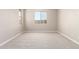 This empty bedroom features large windows that provide plenty of natural light at 31619 N Shady Pasture Ln, San Tan Valley, AZ 85143