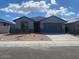 Charming single-story home featuring a gray color scheme, low-maintenance landscaping, and a spacious two-car garage at 31619 N Shady Pasture Ln, San Tan Valley, AZ 85143