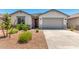 Charming home with a well-manicured yard, a neutral facade, and an attached garage, complete with a dark door at 31619 N Shady Pasture Ln, San Tan Valley, AZ 85143