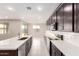 Kitchen has an island with stainless appliances and an adjacent Gathering room at 31619 N Shady Pasture Ln, San Tan Valley, AZ 85143