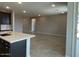 Spacious living room area featuring modern design elements, an open floor plan, and neutral paint to customize at 31619 N Shady Pasture Ln, San Tan Valley, AZ 85143