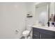 Clean half-bathroom featuring a modern vanity with elegant fixtures and neutral decor at 3335 S Lily Ave, Mesa, AZ 85212