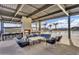 Community lounge area with several seating areas, a fireplace, a bar, and a view of the pool at 3335 S Lily Ave, Mesa, AZ 85212