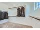 Spacious walk-in closet with carpet flooring, white walls, and wood shelves perfect for storage and organization at 3335 S Lily Ave, Mesa, AZ 85212