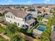 Scenic aerial view of a home with a pool and backyard area within a residential neighborhood at 3415 E Arabian Dr, Gilbert, AZ 85296