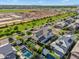 Stunning aerial view of a two-story home showcasing a private pool and green landscaping in a desirable community at 3415 E Arabian Dr, Gilbert, AZ 85296