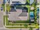 An aerial top-down view of the house showing the pool and back yard and the manicured green lawn at 3415 E Arabian Dr, Gilbert, AZ 85296
