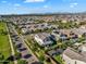 Expansive aerial perspective of a residential neighborhood featuring homes with private pools and lush landscaping at 3415 E Arabian Dr, Gilbert, AZ 85296